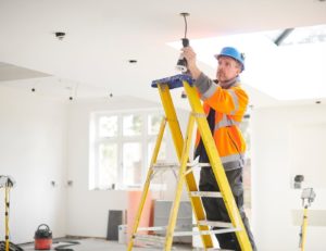 Property Management London - Electrician-installing-light-fitting