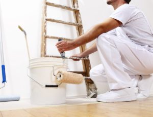 Property Management London - Painter-holding-ladder